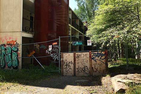 The houses are protected with fences due to vandalism.