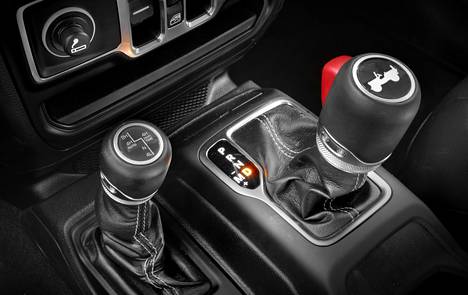 The gear stick is stout. The smaller lever on the left changes the drive mode and engages the reduction gears.