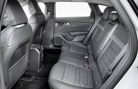 There is ample legroom in the back.  The small window on the C-pillar brings in light. 