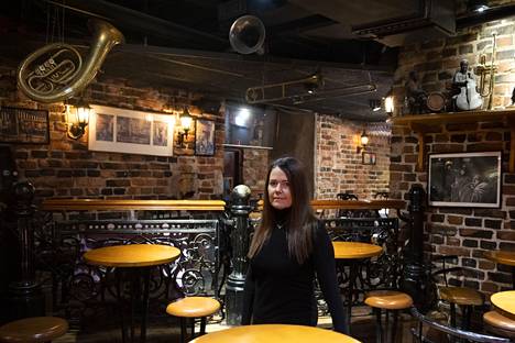 Storyville's interior design is dominated by wood, brick and wrought iron.  The picture shows restaurateur Tuula Railonkoski.