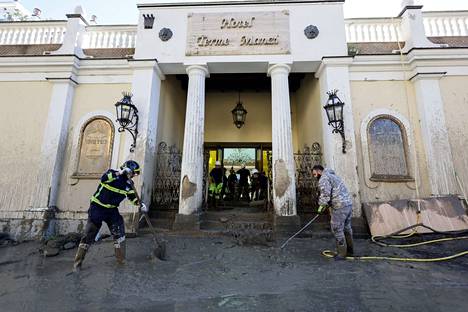 The front of the spa hotel was cleaned of mud on Sunday.