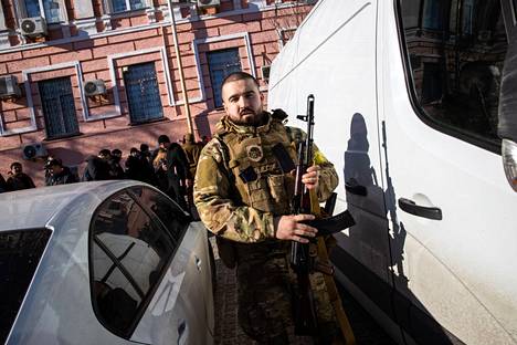 Reserves queued up for weapons in downtown Kiev last Saturday.  Yuri already had his own.  The government had distributed more than 25,000 assault rifles to those willing