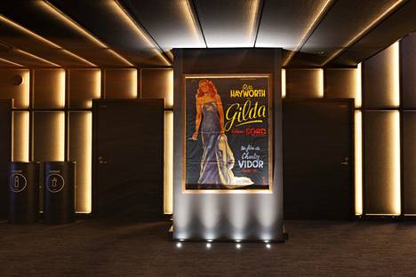 The movie theater has a poster of the movie Gilda released in 1946 from the time of the French release.