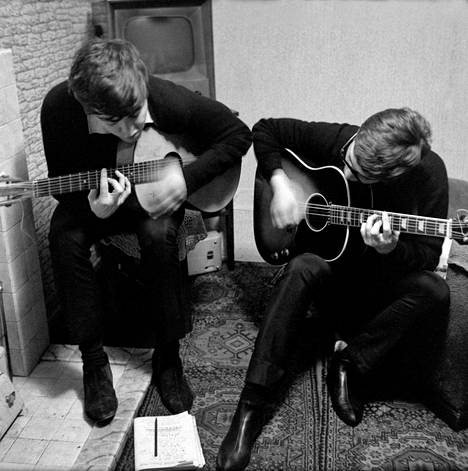 Paul McCartney and John Lennon are developing the song I Saw Her Standing There lyrics facing Liverpool in 1962.