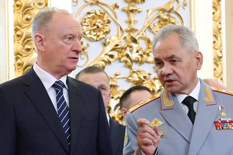 In the photo provided by Sputnik, Patrushev and Shoigu were talking at Putin's inauguration last week.