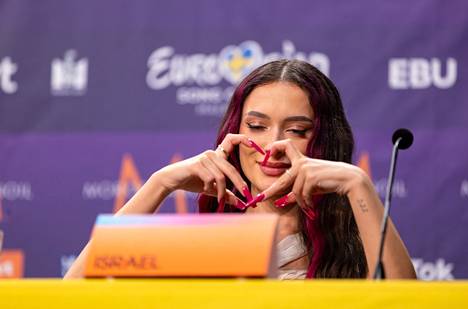 Israel's Eden Golan used his fingers to make a heart symbol during the press conference after Thursday's semifinal.