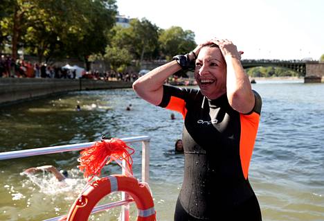 The mayor of Paris, Anne Hidalgo, markets the cleanliness of the Seine by taking a dip in the river.