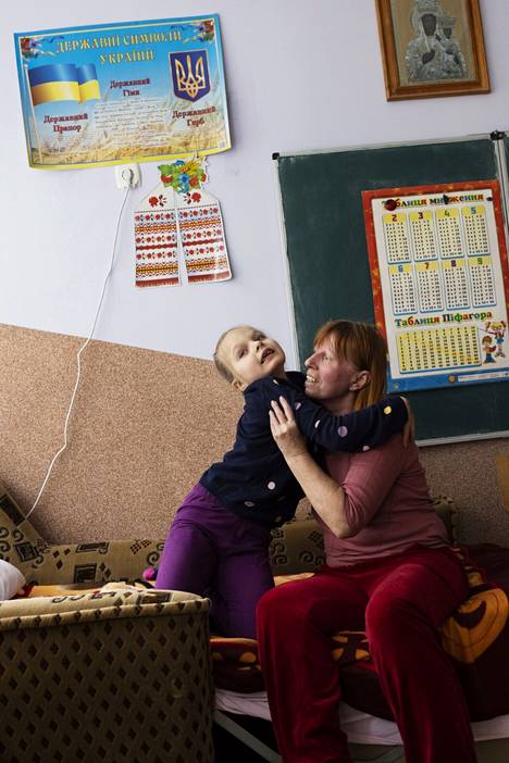 Six-year-old Lisa Ovchinnikova played with her grandmother Alla Ovchinnikova at a school converted into a refugee accommodation center.