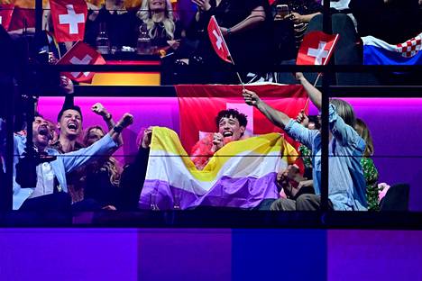 Switzerland's Nemo celebrated with his group as the scoring progressed with the cross-gender flag.