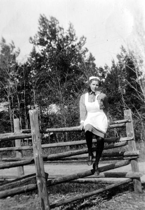 Ulla-Stina Westman sits on the fence of the shooting range.  The track was at the current Hiekkaharju sports park.