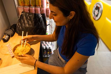 Loredona Urbaez prepared noodles for herself for lunch at JK Shop.