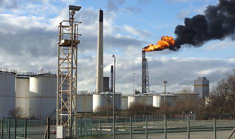 A flame burns in an oil refinery in Britain, which is a so-called safety flare.  It burns excess gases.