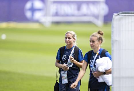 Hyyrynen and Essi Sainio walking off the training ground on Saturday.