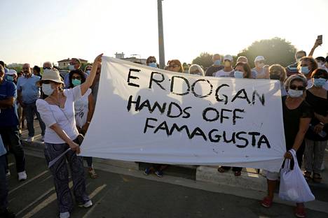 Protesters against the Turkish occupation of Cyprus in the village of Derýneia in the Famagusta region of Cyprus in October 2020.  Famagusta belongs de jure to the Republic of Cyprus, but de facto it is currently occupied by Turkey.  The protesters' sheet reads 
