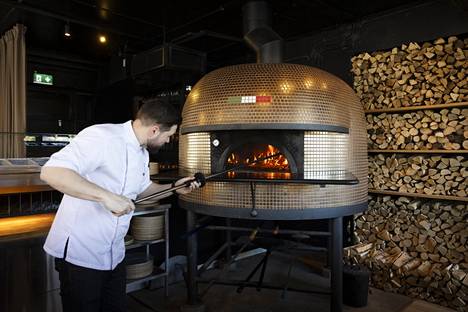 The pizza oven is Italian.  It is heated with halos and can hold eight pizzas at a time.