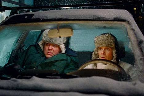 The men at the sawmill (Hannu-Pekka Björkman and Jarkko Lahti) are also sitting in a car lurking in a car, lurking for another spouse. 