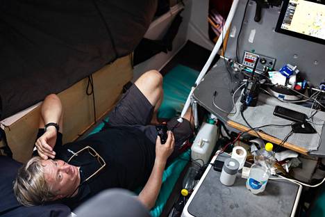 Ari Känsäkoski in his boat in his sleeping place, from which he could steer the boat at the same time.