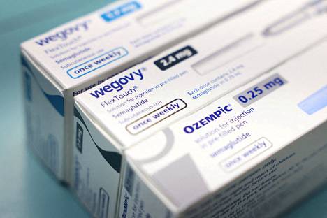 Ozempic and Wegovy medicines in a pharmacy in London.  Buying from a pharmacy requires a prescription from either a public healthcare doctor or a private doctor.  A monthly dose of Ozempic costs about 175 pounds, or 205 euros.