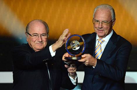 Sepp Blatter, the president of the international football association Fifa, awarded Franz Beckenbauer in 2013. Fifa's corruption investigations have since tarnished the reputation of both men.