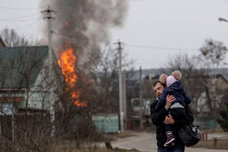 People fled the city of Irpin near Kiev on Sunday.