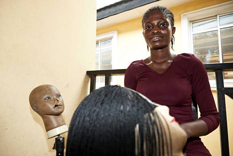 Gloria Honfo is a 22-year-old hair artist in the Makoko slum. 