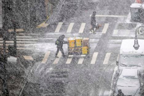 Pedestrians in Manhattan, New York on Tuesday.