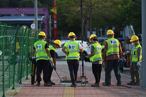 Työntekijöitä kadulla Guangzhoussa 20. marraskuuta. 