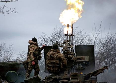 A Ukrainian soldier fires an anti-aircraft cannon on the outskirts of the city of Bahmut in Ukraine.