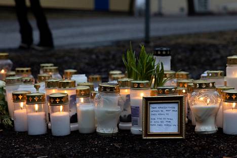 In addition to candles, flowers and other souvenirs had been brought to the place.