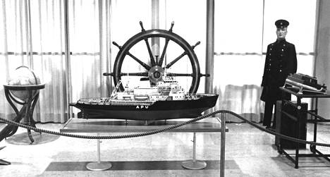 The miniature model of the icebreaker Apu takes pride of place in the port exhibition, surrounded by historical maritime artifacts.