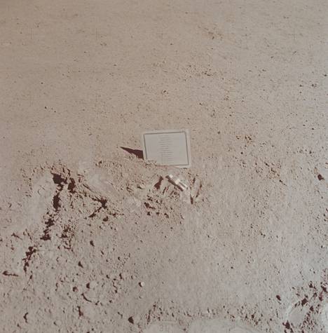 The crew of the Apollo 15 flight left a work of art on the moon in memory of the astronauts and cosmonauts who died in space.  A small aluminum sculpture depicts a space walker.  The names of the dead are listed in the table next to it.