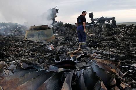 Ukrainian rescue authorities investigate the remains of a decommissioned Malaysian passenger plane in the Donetsk region in July 2014.