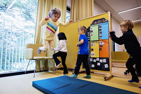 Leon Peltonen, 5, Koda Tuomivirta, 5, Athena Atayi, 4, and Venla Kurasto, 5, do magic jumps in the premises of a group called Kanguruts.