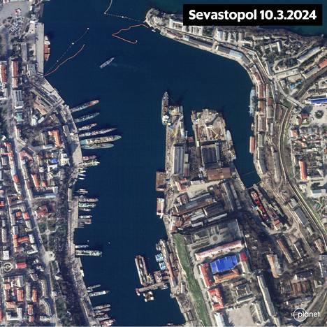 Planet Labs satellite image of Sevastopol.  The upper corner of the picture shows the booms used to combat drones.  In the harbor you can also see a considerable number of ships undergoing maintenance.