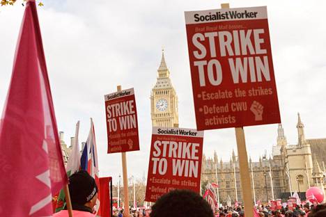 Royal Mail workers demonstrated next to Big Ben in the Houses of Parliament.