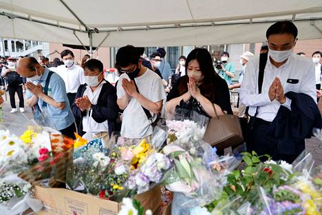 According to news agencies, hundreds of people brought flowers to the place where Abe was killed on Saturday.