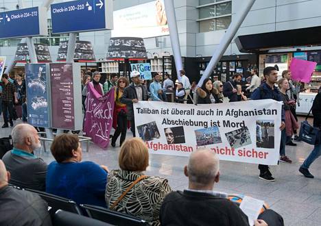 Human rights activists protest against the deportation of Afghans at Düsseldorf Airport in Germany in September 2017. This summer, activists in Germany have demanded that return flights to Afghanistan be stopped due to the deteriorating security situation. 