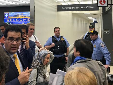 Lawyers gather to discuss how to gain access to a detainee held under a travel ban imposed by U.S. President Donald Trumps executive order, at Washington Dulles International Airport in Dulles, Virginia, U.S. January 28, 2017.