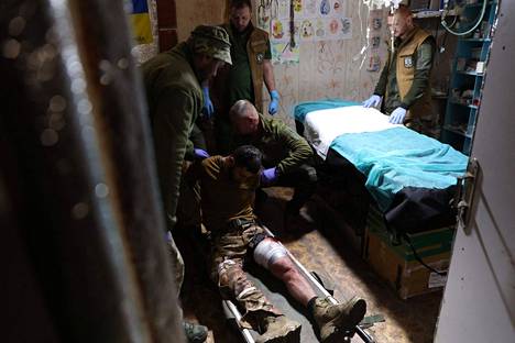 A wounded Ukrainian soldier was treated near Bahmut in eastern Ukraine on Tuesday.