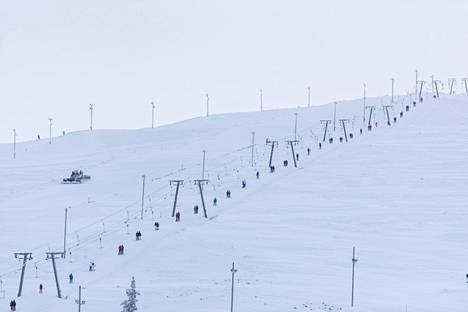 Skiers on the slopes rising above the village of Äkäslompolo north of Yllästunturi on Saturday.