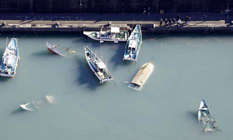 Boats likely to be overturned by a tsunami in Toto following a volcanic eruption in Muroto, Japan, on Sunday.