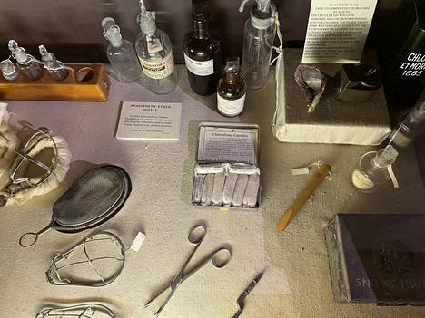 View of the operating room museum.  White chloroform capsules in the foreground.  The instructions state: 