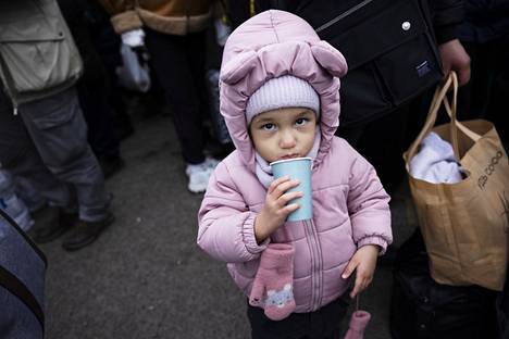 The little girl queued for entry across the Ukrainian border into Poland in Krakow on Wednesday.