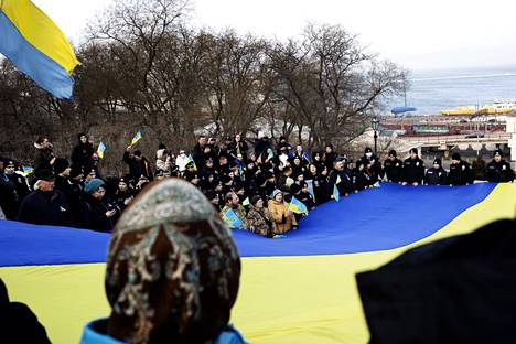 The procession carried the giant Ukrainian flag.