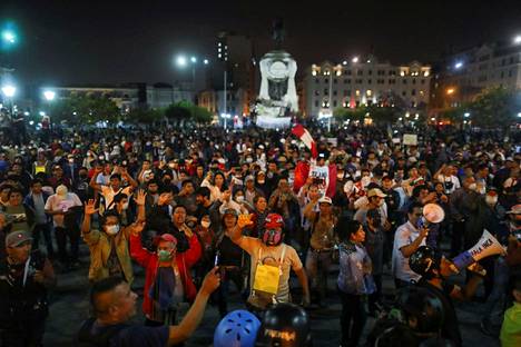 People gathered on the streets of Lima on Friday to demonstrate.  They demanded new elections and Castillo's release.