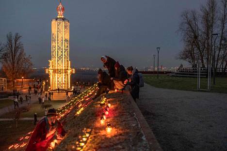 People lit candles in Kiev for Holodomor Remembrance Day on Saturday.