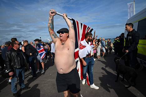 A protester waved a British flag in Weymouth on Sunday.