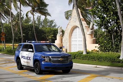 A police car outside Donald Trump's Florida mansion in August of last year, when authorities raided the mansion in search of secret presidential administration documents in Trump's possession.