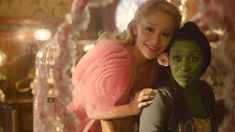 Glinda (Ariana Grande, left) and Elphaba (Cynthia Erivo) are study mates at the University of the Wonderland of Oz.