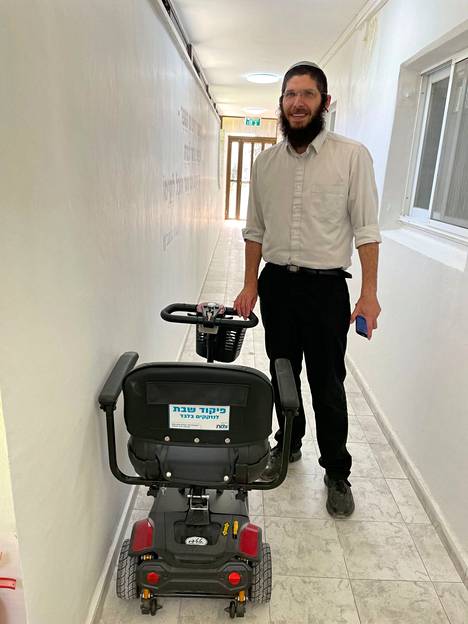 Menashe Zimmerman presents a mobility scooter that can also be used by people with reduced mobility on Shabbat.